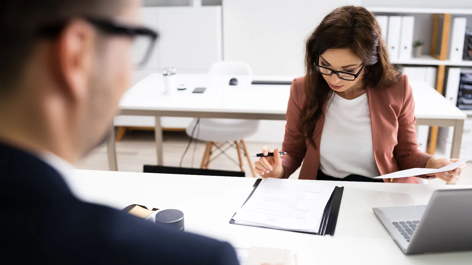 Woman interviewing a man for a job.