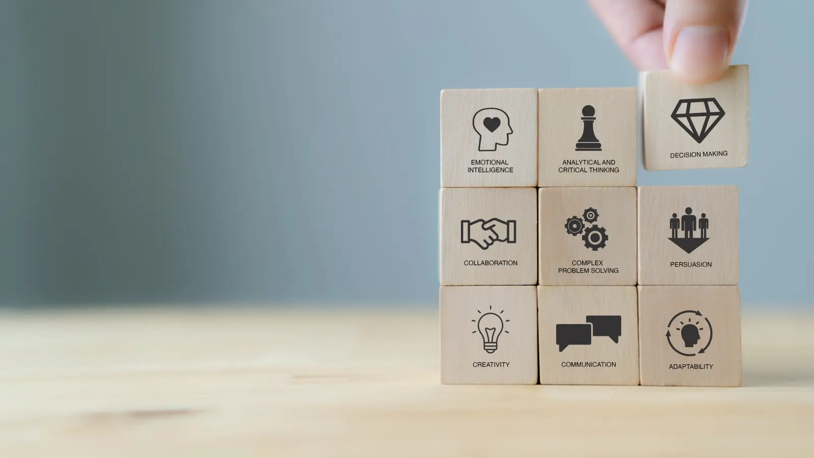 Photo of a stack of blocks with different types of soft skills written on them.